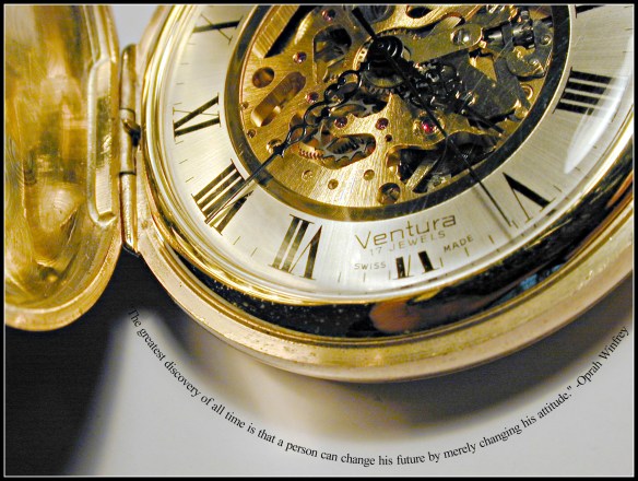 close up on the hands and mechanism of a swiss made pocket watch